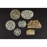 A small collection of Chinese 20th century carved hardstone plaques
comprising three circular