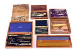 A collection of six sets of drawing instruments in wooden caseslate 19th/early 20th century