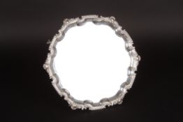 A George VI silver pie crust salverhallmarked 1938, with shaped embossed rim decorated with
