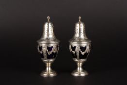 A pair of late 19th century French silver sugar siftersof baluster form with blue glass liners, the