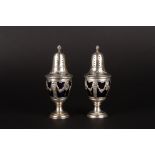 A pair of late 19th century French silver sugar sifters
of baluster form with blue glass liners, the