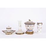 A late 19th century Continental porcelain desk set
comprising an inkwell, a candlestick and a