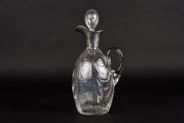 An Edwardian silver and glass claret jug by William Comynshallmarked London 1902, the ovoid body
