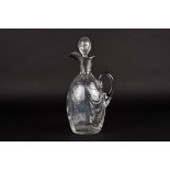 An Edwardian silver and glass claret jug by William Comyns
hallmarked London 1902, the ovoid body