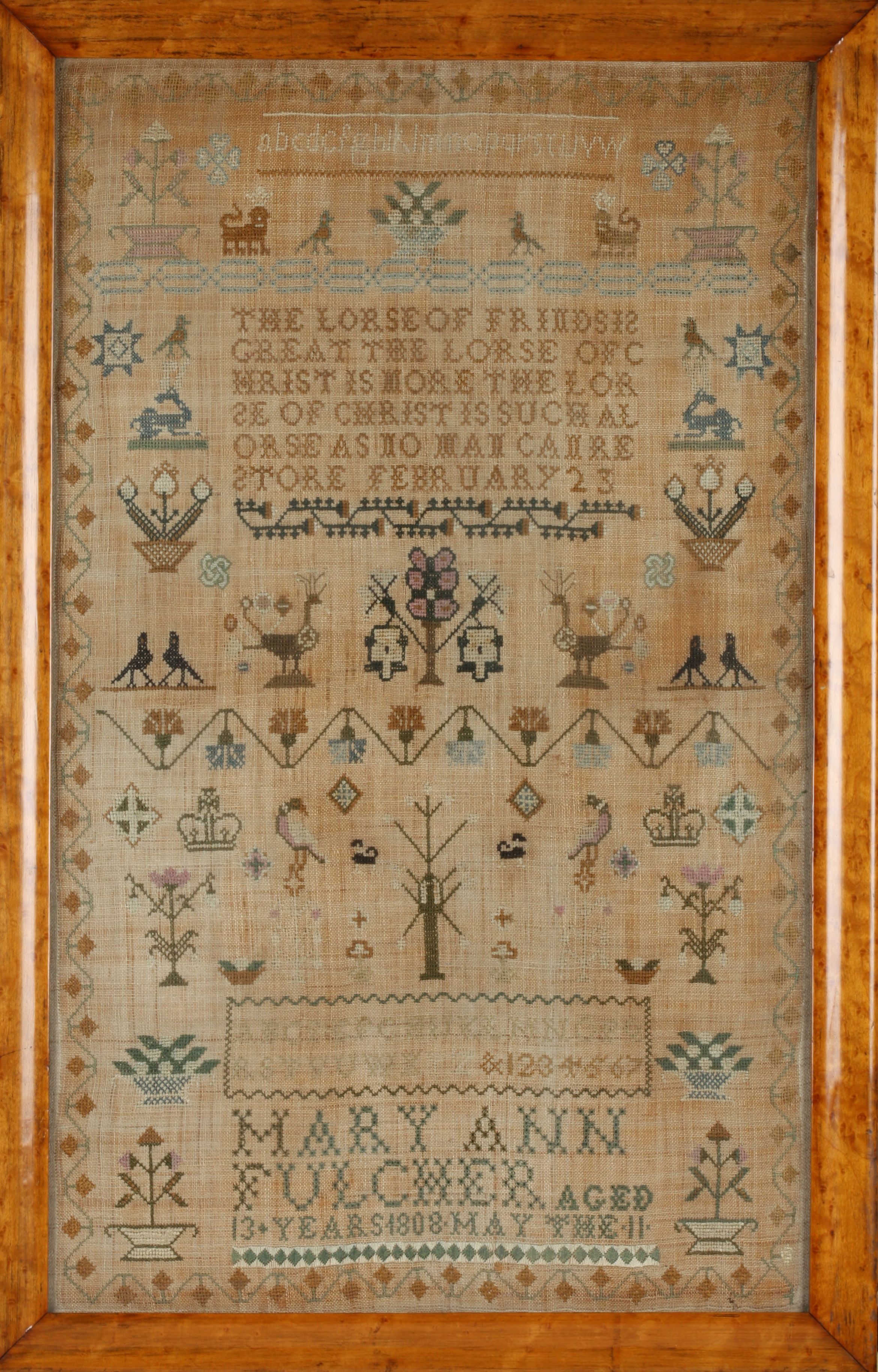 A large early 19th century sampler
dated 1808, embroidered in coloured threads by Mary Ann aged 13