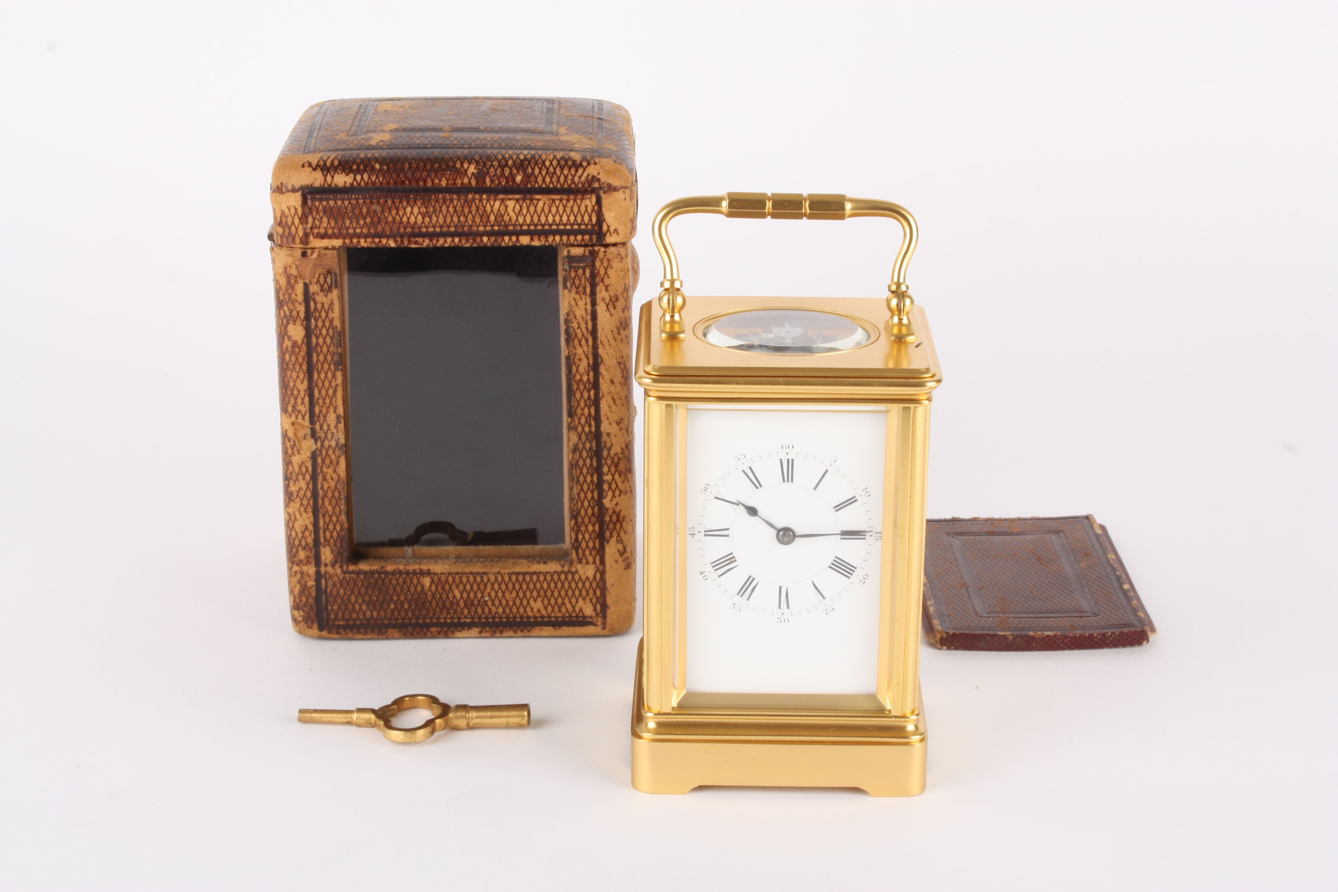 A late 19th century French gilt brass carriage clock timepiece by Henri Jacot
the white enamel
