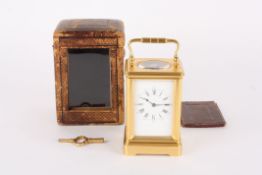 A late 19th century French gilt brass carriage clock timepiece by Henri Jacotthe white enamel