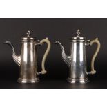 A pair of George III style late 20th century silver coffee pots
with Sheffield import marks and