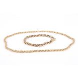 A 9ct gold two tone necklace and matching bracelet
of rope twist form., Bracelet 7 inches long. 21.5