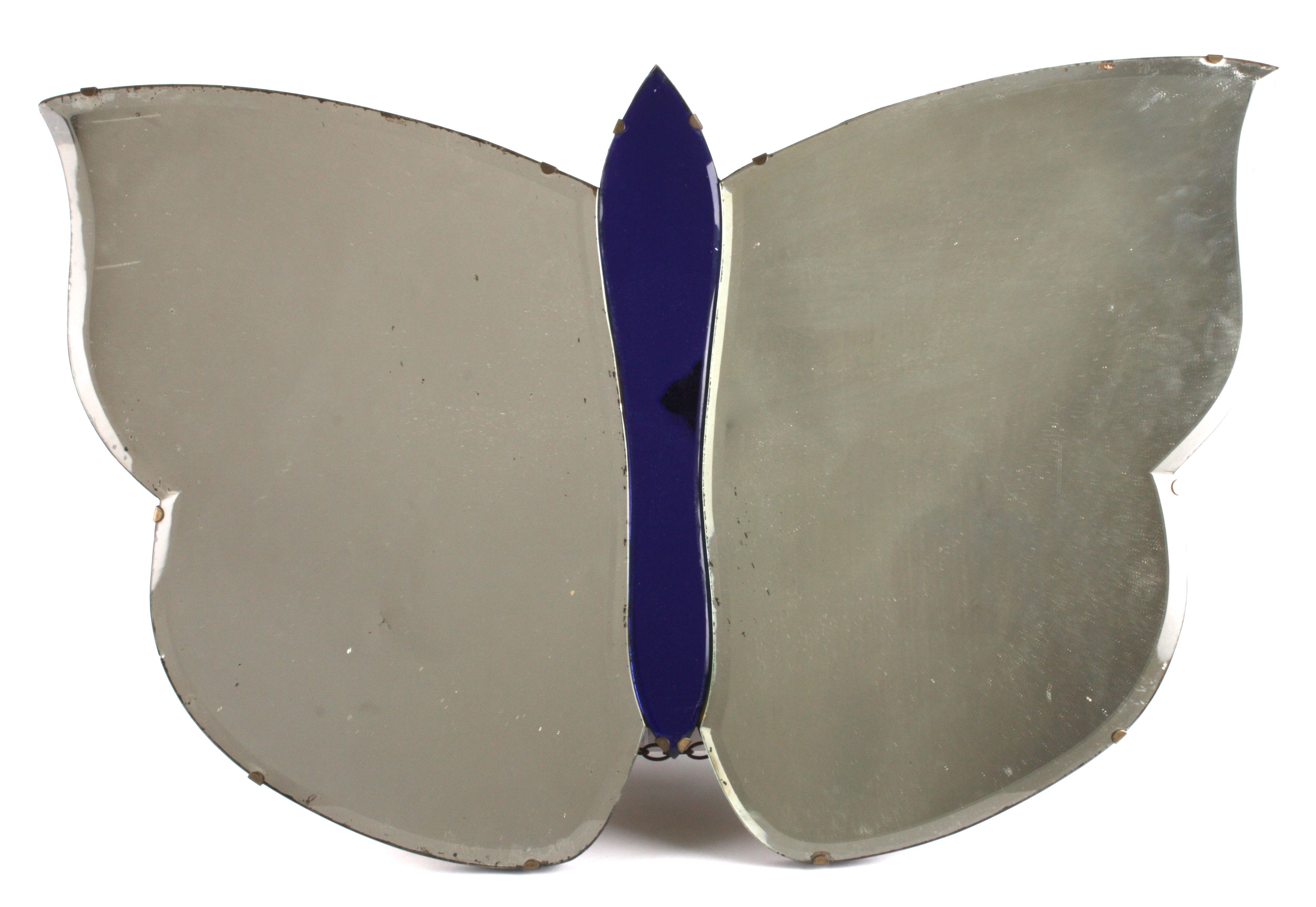 A vintage mirror in the form of a Butterfly
with bevelled edge, width 74cm, height 47cmCondition: