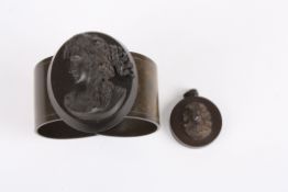 An early 20th century vulcanite cameo style cuff braceletdecorated with an oval portrait of a young
