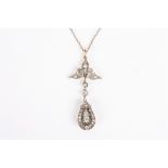 An early 20th century diamond pendant
the central diamond weighing approx. 0.10cts surrounded by