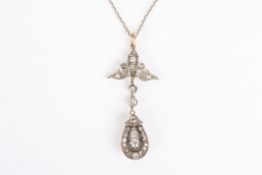 An early 20th century diamond pendantthe central diamond weighing approx. 0.10cts surrounded by