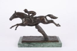 David Cornell (20th century) British
A bronze model of a race horse and jockey 'Champion Finish',