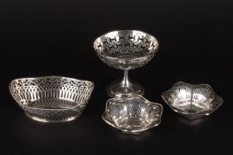 A collection of four pierced silver bonbon dishescomprising a small tazza, an oval basket and two