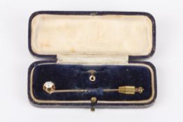 A single stone Victorian diamond set stick pinthe old cut diamond mounted and detachable, with