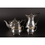 A George VI silver four piece silver tea set
hallmarked Sheffield 1938, comprising teapot, hot water