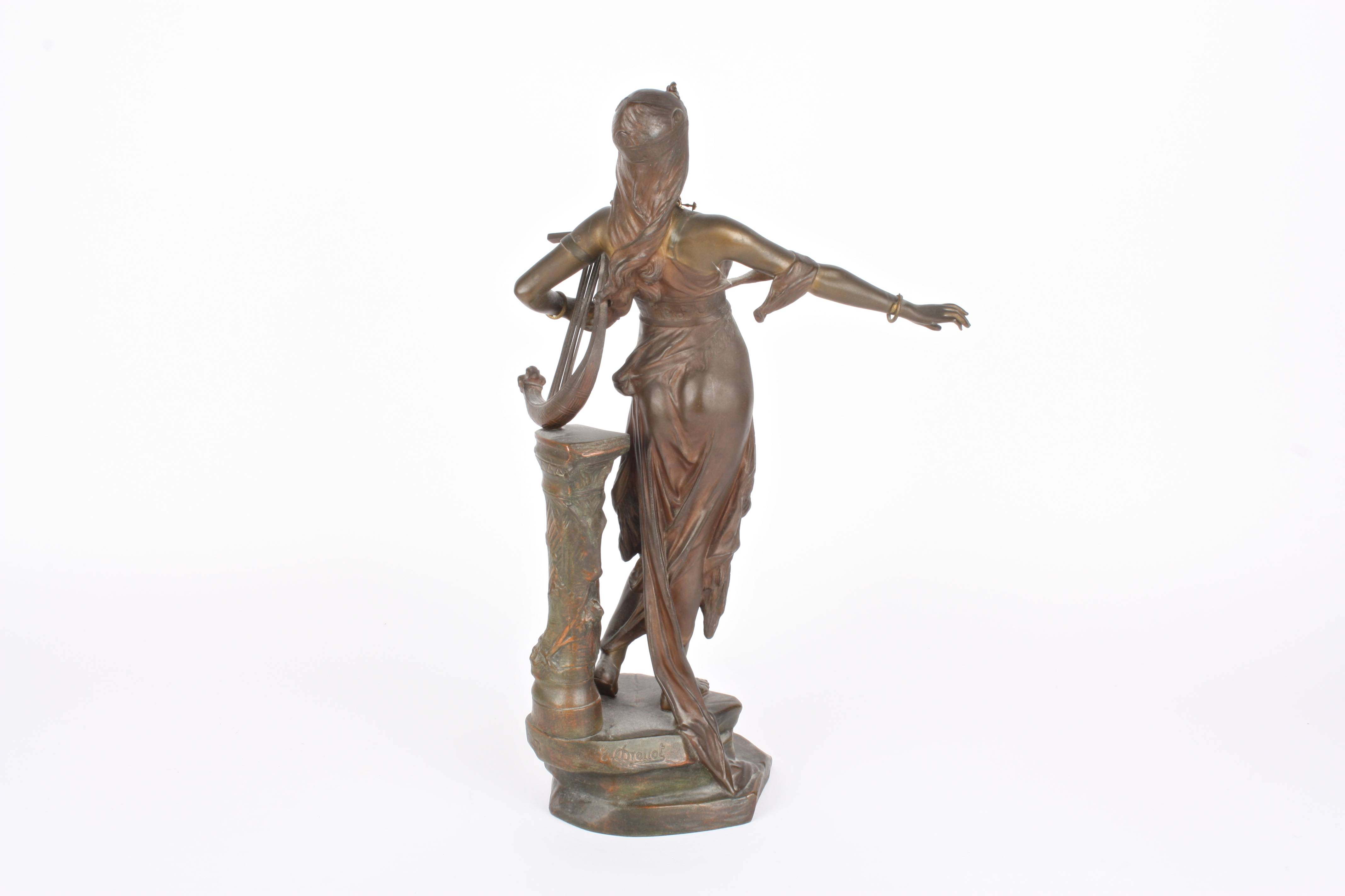 Édouard Drouot (1859-1945) French
a bronze model of a classical lady playing a small harp, wearing a - Image 2 of 3