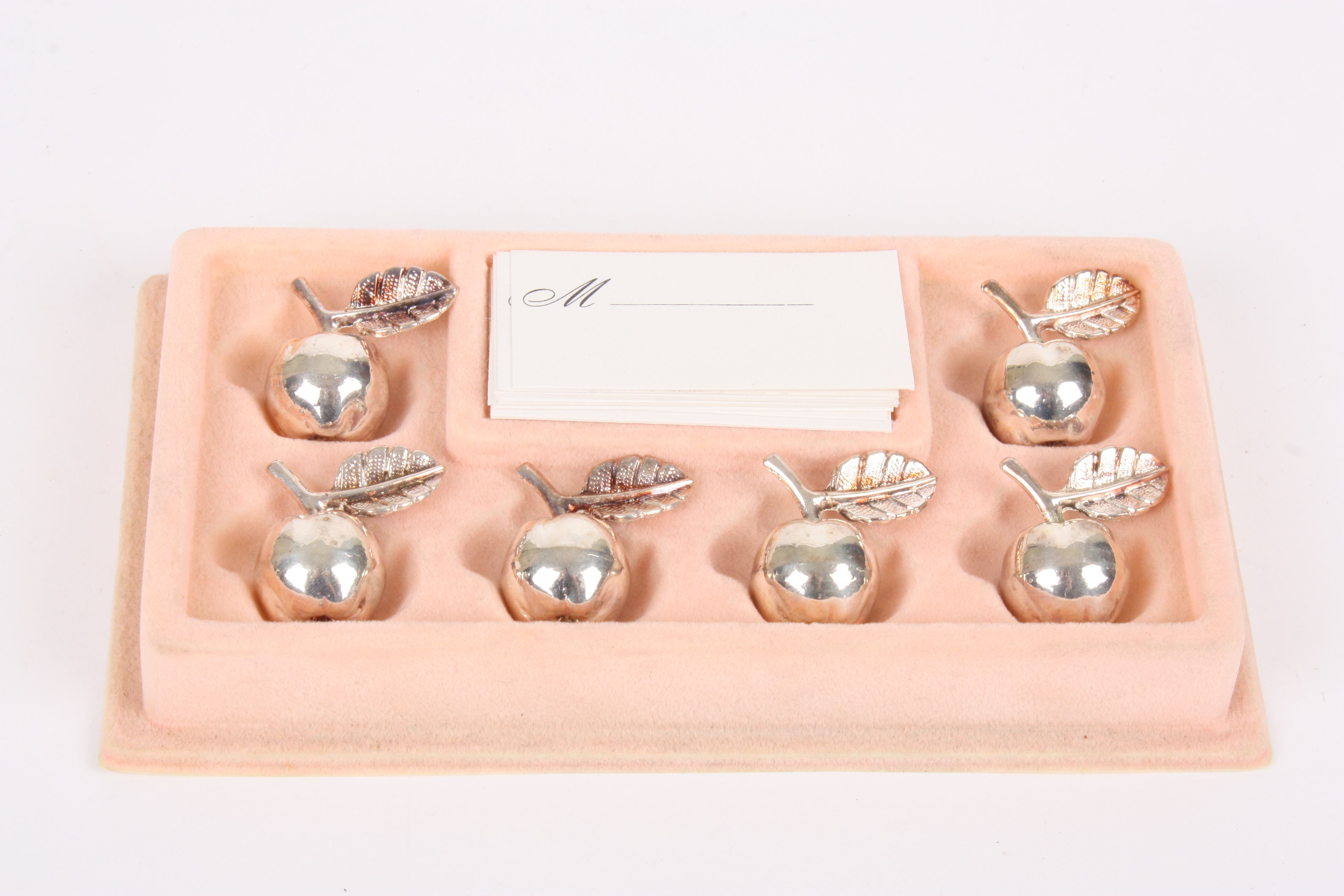 A French 20th century set of six white metal place-card holders in the form of apples
each apple
