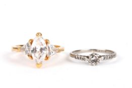 An 18ct gold and diamond solitaire ringthe diamond weighing approx. 0.12cts, set with four small
