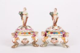 A pair of mid 20th century Italian Capodimonte porcelain salts and coversthe lids crested with