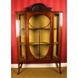 A large Edwardian mahogany inlaid display cabinet
the carved pediment over a single astragal