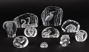 A collection of ten Swedish Kosta Svenskt glass animal paperweightsof intaglio form of various