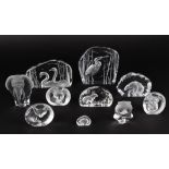 A collection of ten Swedish Kosta Svenskt glass animal paperweights
of intaglio form of various