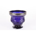 A George III Bristol blue glass and silver urn
the gadrooned silver rim hallmarked London 1794,