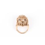 A heavy 9ct gold lions head ring
well modelled with mouth open and sapphire eyes., Approx 26.8 grams