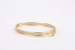 A 9ct gold three tone gold braceletwith basket weave decoration., 10.3 grams.Condition: Generally
