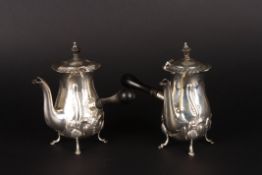 A pair of Edwardian embossed silver chocolate potshallmarked Birmingham 1909, with floral