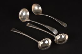 A pair of George III silver sauce ladles
hallmarked Sheffield 1777, together with two other silver