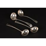 A pair of George III silver sauce ladles
hallmarked Sheffield 1777, together with two other silver