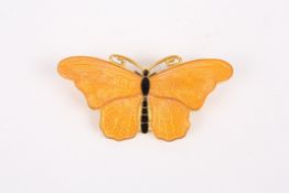 A Swedish guilloche enamel brooch in the form of a butterflythe engine turned yellow enamel wings