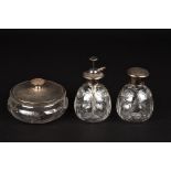 A George V three piece silver dressing table set
hallmarked London 1931, with engine turned