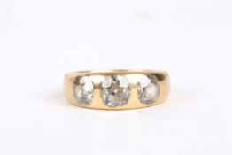 An 18ct gold and diamond three stone ringset with central stone weighing approx. 0.75cts, flanked