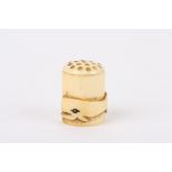 An unusual whale ivory whalers thimble
the thimble carved in relief with a single whale  , length