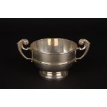 An Edwardian silver two handled sugar bowl
hallmarked Sheffield 1903, with twin scrolled handles and