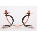A mid 20th century copper and wrought iron decorative candlestick holder
the twin lights with shaped