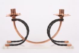 A mid 20th century copper and wrought iron decorative candlestick holderthe twin lights with shaped