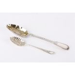 Two berry spoons
the first larger spoon silver and hallmarked London 1864 the gilded bowl with fruit