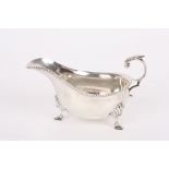 A George V silver sauce boat
hallmarked Sheffield 1931, with gadrooned rim and scrolled acanthus