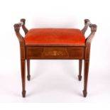 An Edwardian mahogany inlaid piano stool
with twin handles and upholstered rising top, supported