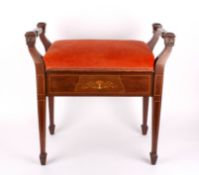 An Edwardian mahogany inlaid piano stoolwith twin handles and upholstered rising top, supported