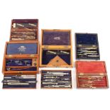 A collection of five sets of drawing instruments contained within wooden cases
late 19th and early