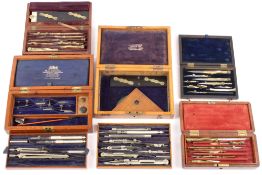 A collection of five sets of drawing instruments contained within wooden caseslate 19th and early