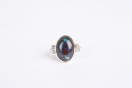 A Continental 14ct gold, opal and diamond ringset with central oval black opal, and mounted with