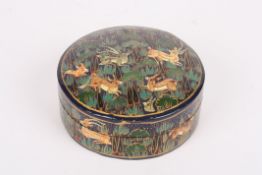 A mid 20th century Persian circular lacquered box and coverthe domed lid and body painted with deer