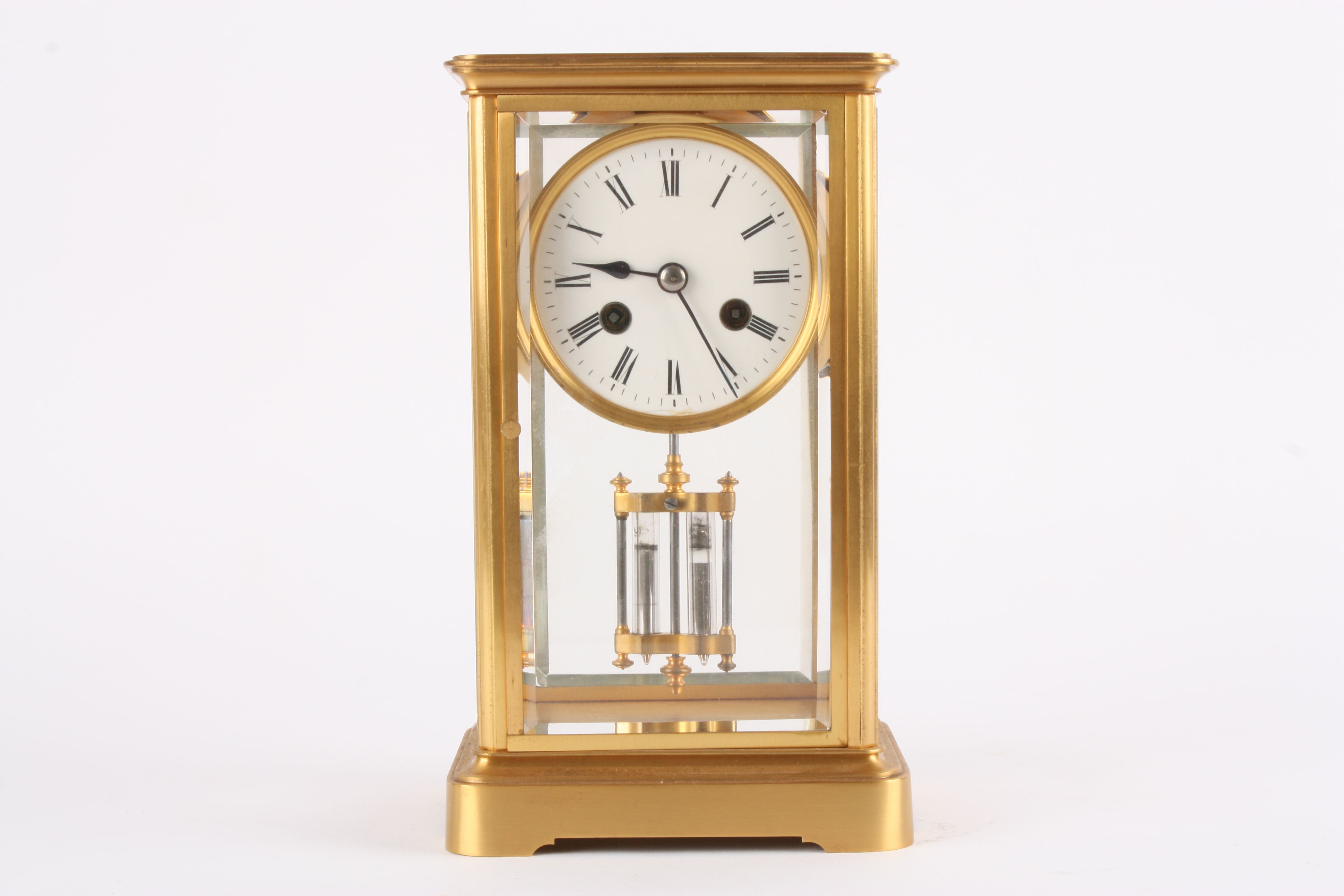 A Victorian gilt bronze four glass mantle clock of small proportions
the white enamel dial with